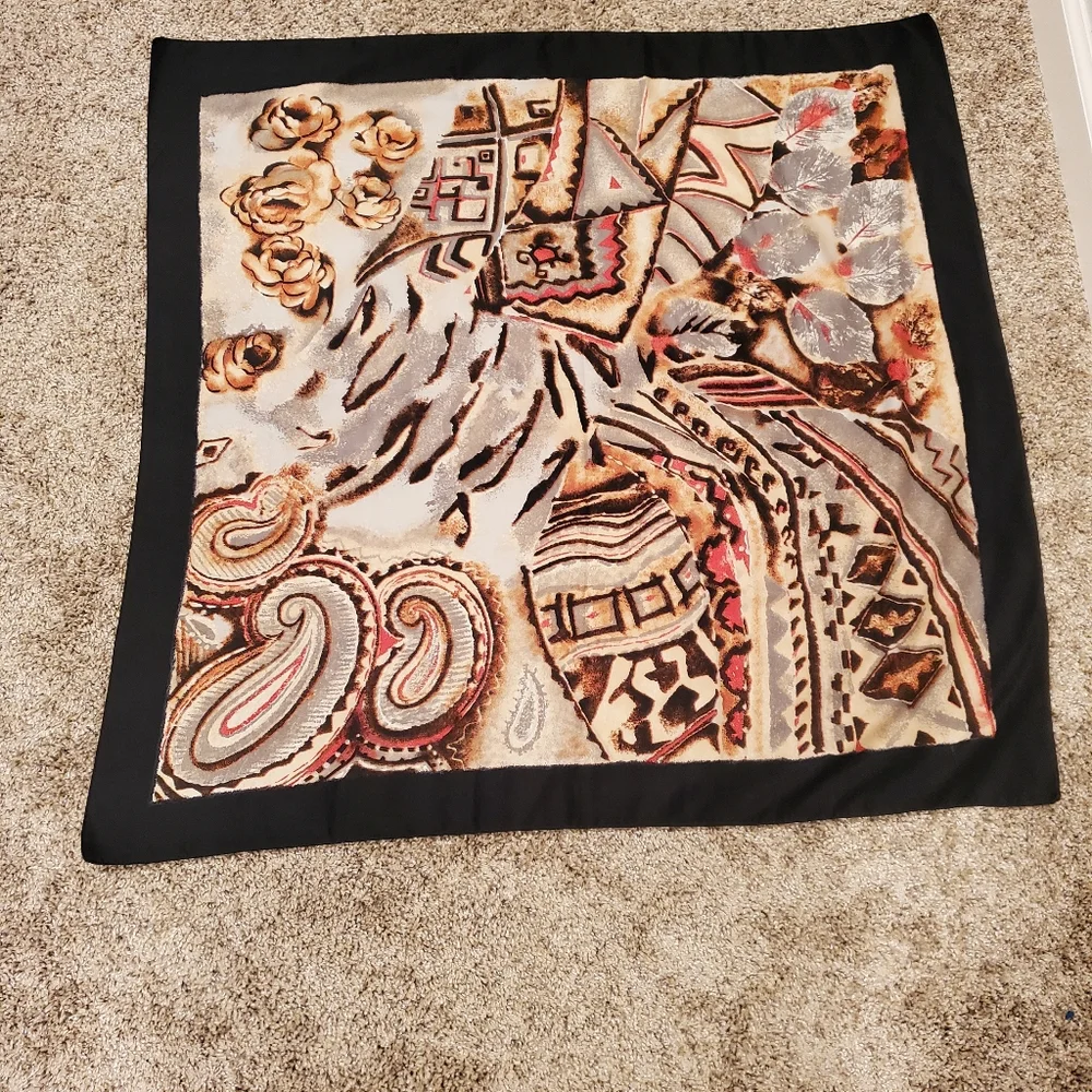 scarf with a black outline and a multi-colored abstract floral and paisley
